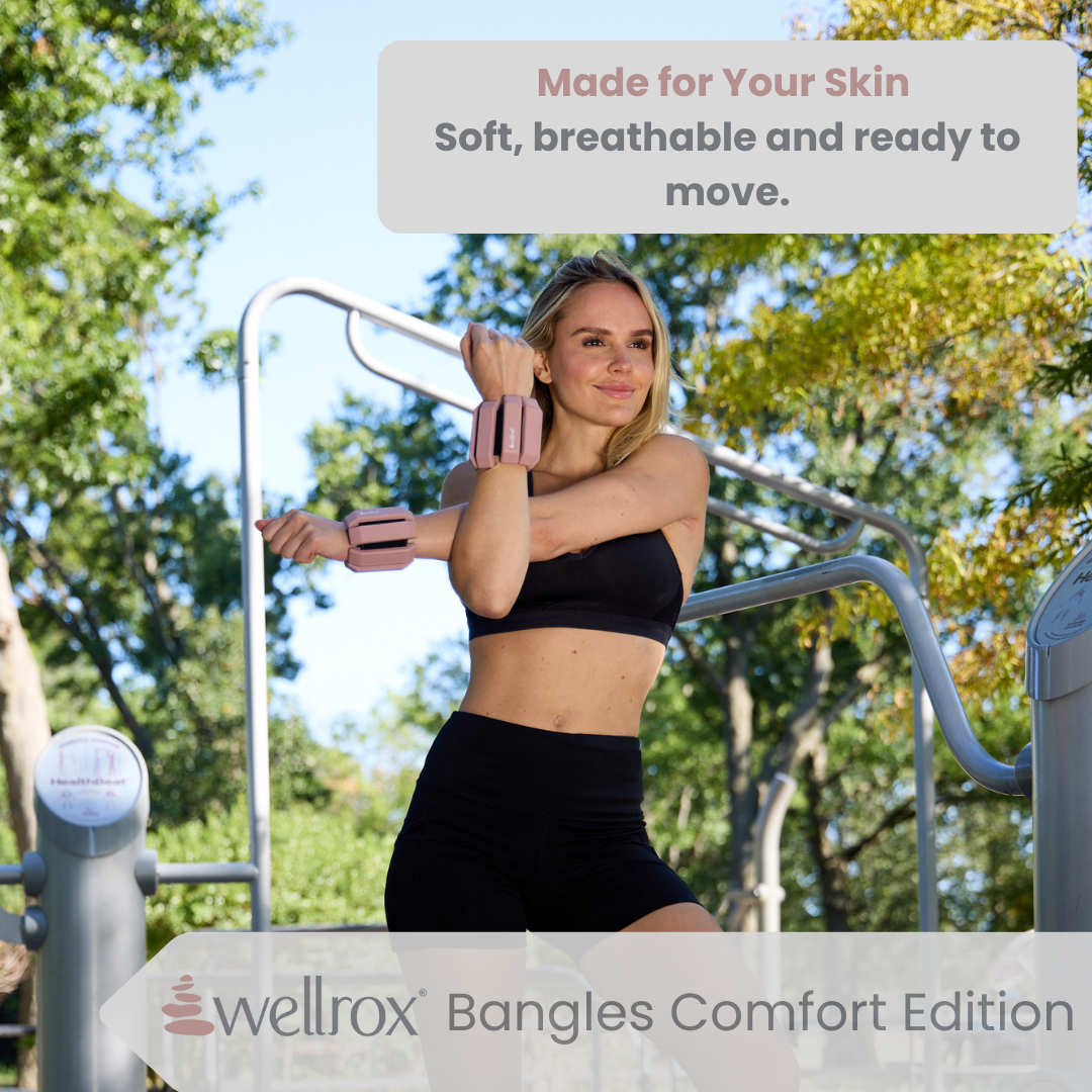 Woman stretching outdoors in exercise park with Adjustable 1.2lb weighted bangles