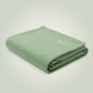 Folded green hand-loomed Indian cotton soft cozy machine washable Wellrox yoga blanket, restorative yoga prop