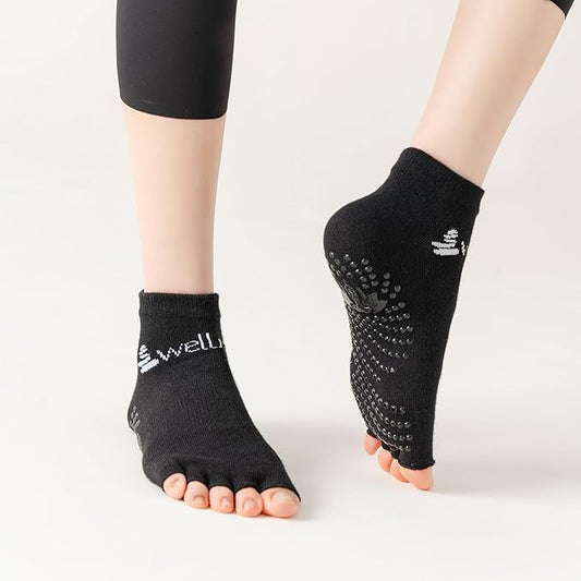 woman wearing Black toe-separated socks with grippy non-skid sole