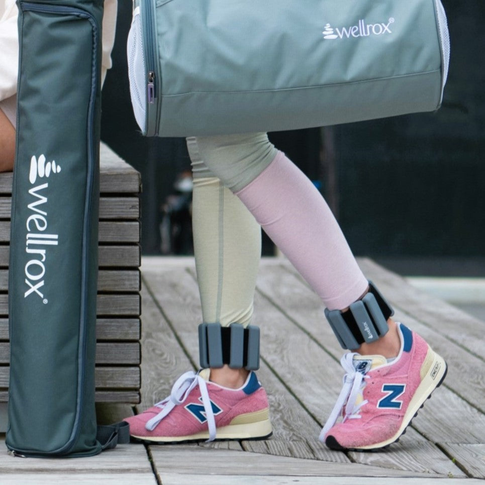 stylish set of silocone wearable wrist and ankle weights on ankles