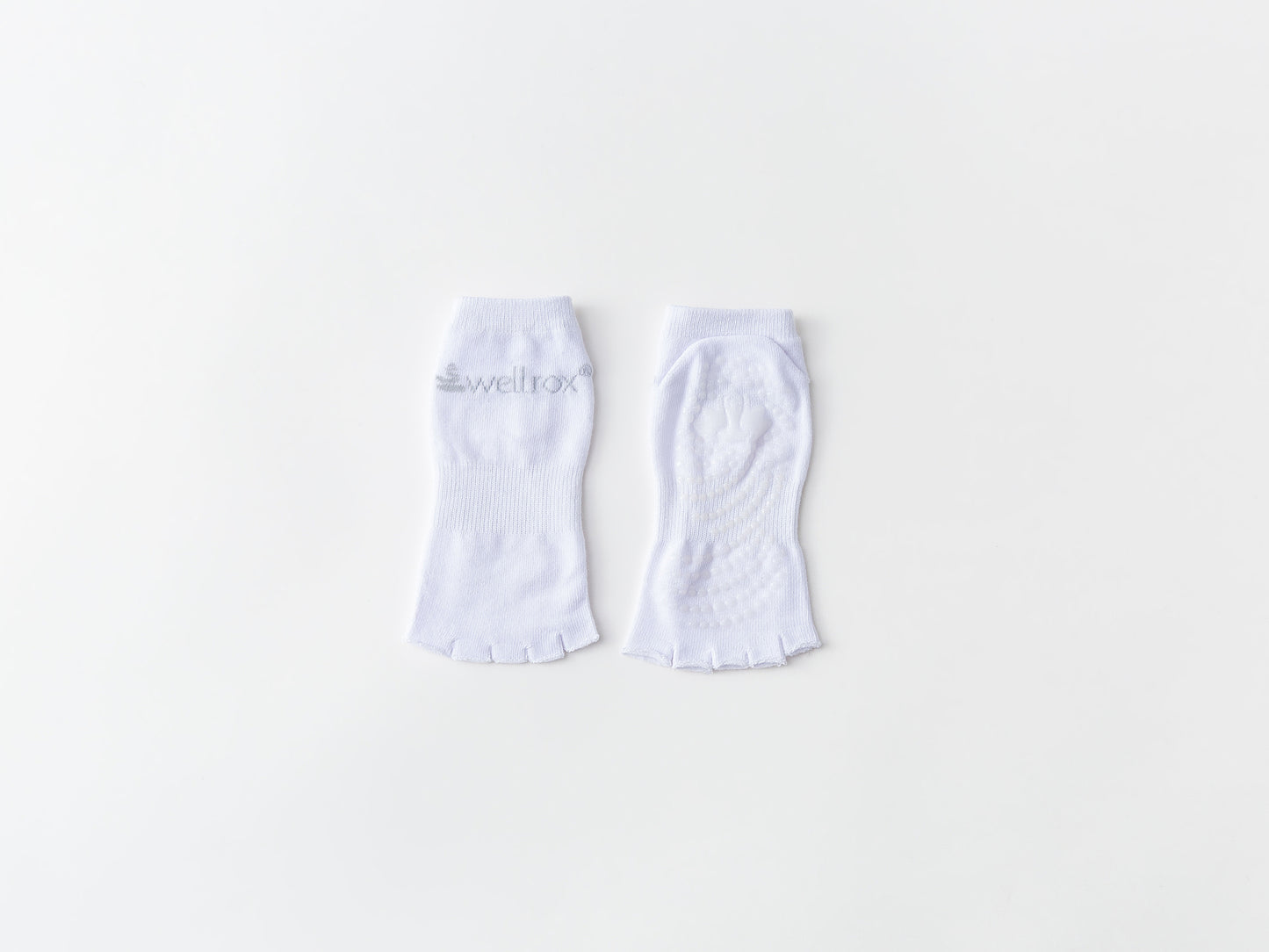 pair of non-skid toeless grip white barre socks, white toeless non-skid Pilates socks, white grip open toe yoga socks