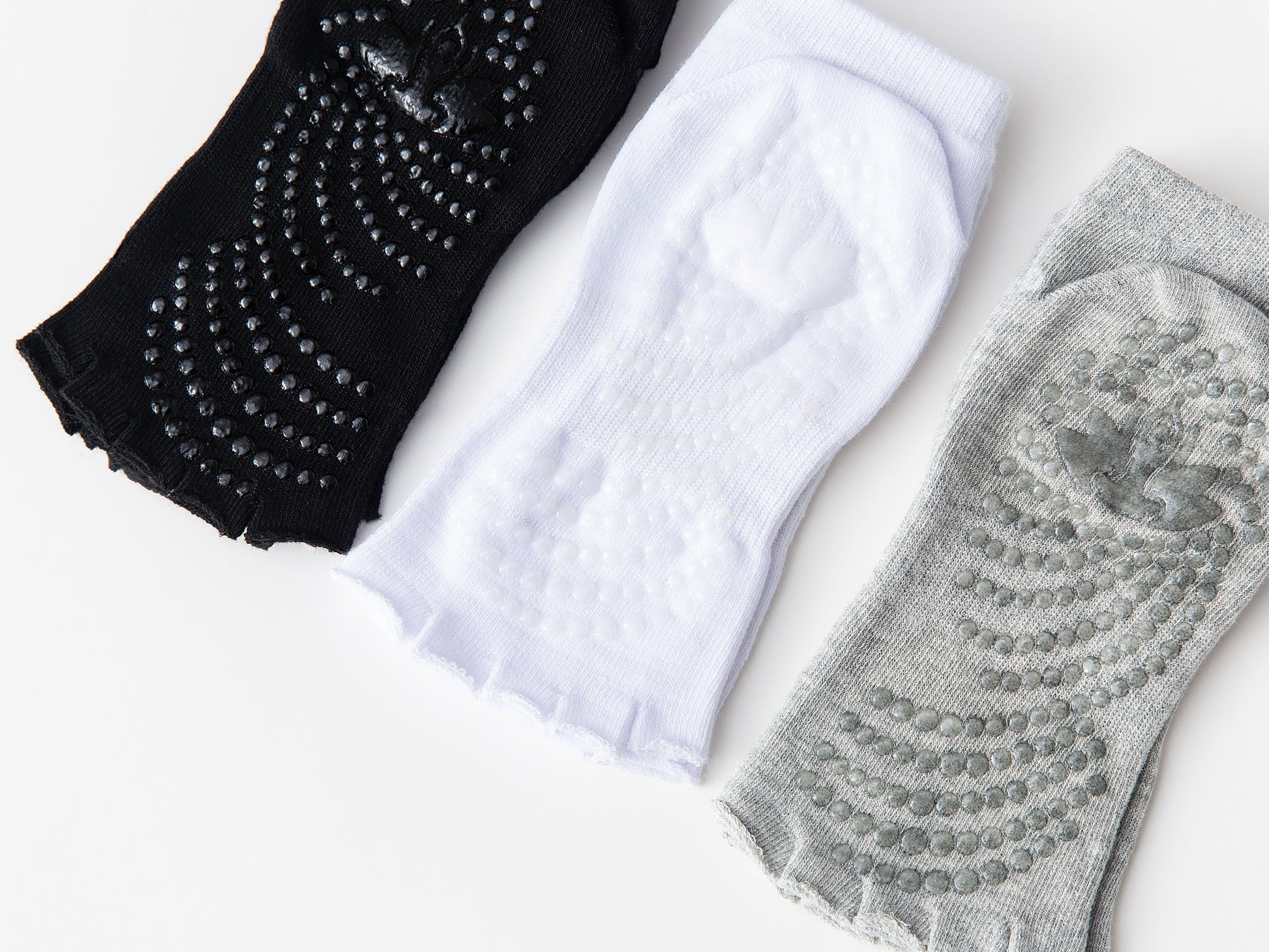 three pairs of open-toe, non-skid barre socks